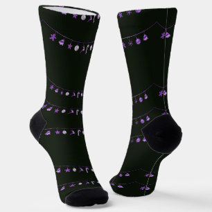 Purple hanging Xmas ornaments on black Socks