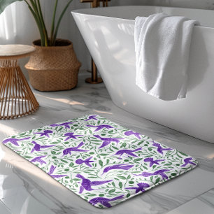 Purple hummingbirds with green flowers & leaves bath mat