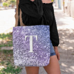 Purple Ombre Chunky Glitter Monogrammed Tote Bag<br><div class="desc">A modern bold single letter double layer monogram in white with a black drop shadow. The font size, colour and style are customizable. The background is a faux lavender, purple and periwinkle gradient glitter with sparkly spots or blurry bokeh. Move or delete the tiny faux sparkle graphics. A nice gift...</div>