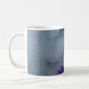 Purple petaled flower on grey surface coffee mug