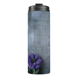 Purple petaled flower on grey surface thermal tumbler