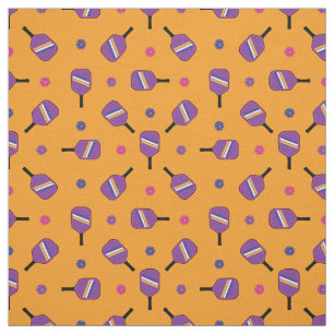 Purple Pickleball paddles on orange Fabric