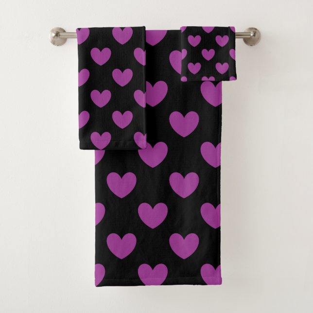 Purple polka hearts on black bath towel set (Insitu)
