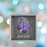 Purple Rustic Butterfly Personalized Locket Necklace<br><div class="desc">Create a unique gift for her with a Purple Rustic Butterfly Personalized Silver Plated Necklace. Necklace design features a butterfly against a white leaf vine and dark grey wooden background with a place to personalize with your name. Additional items available with this design as well. Please contact me directly for...</div>