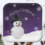 Purple Snowman Winter Scene Christmas Paper Plate<br><div class="desc">Brighten your holiday party supplies with this Purple Snowman Winter Scenery Paper Plates, perfect for your Christmas party supply needs. These charming plates feature a winter scene with a snowman and top hat, accented by white snowflakes and falling snow. The holiday typography displaying "Merry Christmas" adds a joyful touch to...</div>