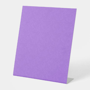 Purple textured surface with swirling pattern pedestal sign