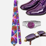 Purple Tropical Hawaiian pattern Tie<br><div class="desc">The Hawaiian print men's tie showcases a stunning illustration of tropical leaves in a captivating peacock shade. This unique colour combination adds a touch of intrigue and sophistication to the tie, making it a standout accessory for any occasion. The peacock shade, with its deep and rich hues of blue, green,...</div>