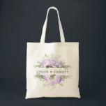 Purple White Floral Wedding Tote Bag<br><div class="desc">The wedding couple's names are surrounded by top and bottom borders of white hydrangea flowers and purple roses. There is a variety of leaves and branches that give it a very modern and chic vibe. This item is part of the Violette collection. I has templates you can use to create...</div>