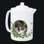 Purrrfect Tea Cute Calico Kitten<br><div class="desc">Cat lovers will delight in this teapot with cute calico kitten snuggled in a jade plant. Her unique green eyes are irresistible. Purrrfect Tea for You and Me text is included. Text may be personalized in template provided. You may also enjoy matching mugs and tea jar as well as the...</div>