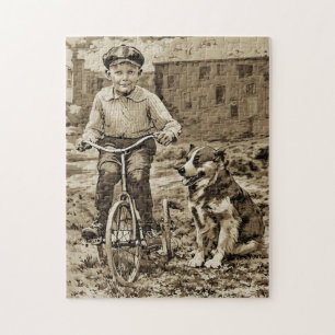 Puzzle À l'époque garçon à vélo avec chien