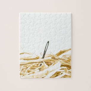 Puzzle aiguille dans une meule de foin