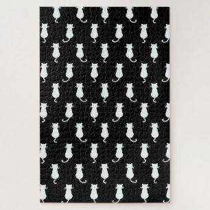 Puzzle Chat blanc isolé sur motif à pois noirs