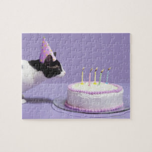 Puzzle Chat portant un casquette d'anniversaire soufflant