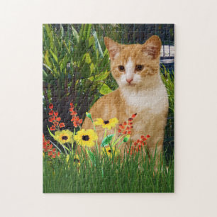 Puzzle Chat tigré orange dans un jardin fleuri pour les a