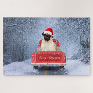 Puzzle Chien Carlin dans la neige assis dans un camion de