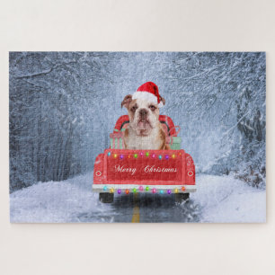 Puzzle Chien de taureau anglais en neige assis sur un cam
