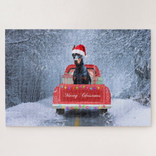 Puzzle Chien Doberman dans la neige assis dans un camion 