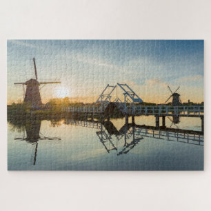 Puzzle Drawbridge and windmills at sunset in Holland