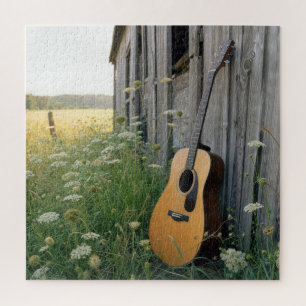 Puzzle Guitare acoustique appuyée contre une grange de ca