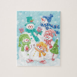Puzzle Jolie famille des neigeurs de Noël dans la neige