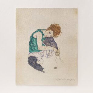 PUZZLE L'ART, EGON SCHIELE A ASSIS LA FEMME AVEC DES