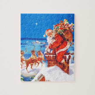 Puzzle Le père noël et son renne sur le dessus de toit