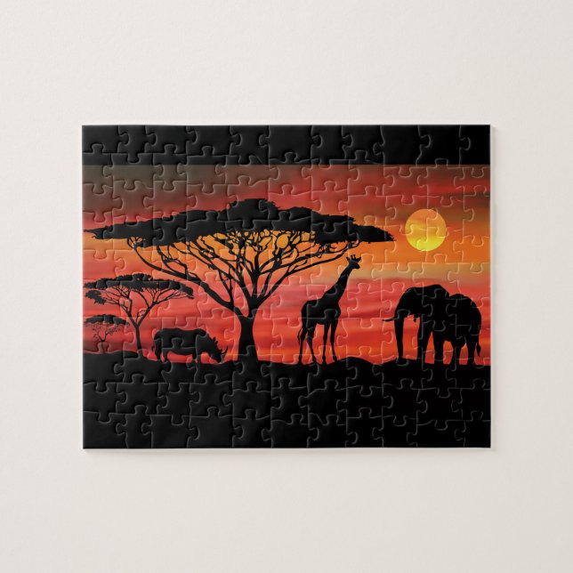 Puzzle Les animaux africains dans le coucher de soleil du (Horizontal)