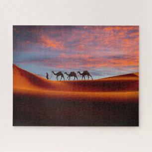 Puzzle Les déserts   Homme et chameaux dans les dunes de 