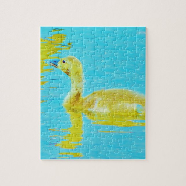 Puzzle Oie-bébé jaune avec eau bleu clair (Vertical)