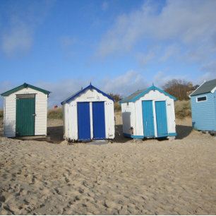 Puzzle old beach huts and blue sky English seaside photo