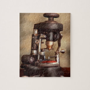 Puzzle Optométrie - Machine à découper de lentilles