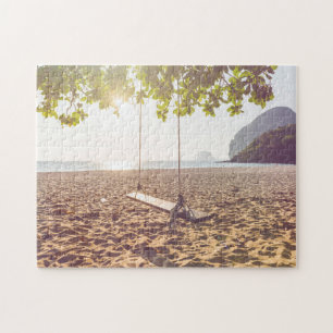 Puzzle Oscillation sur la plage au coucher du soleil