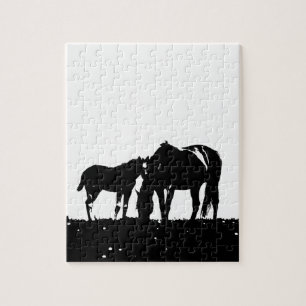 Puzzle Silhouette des chevaux noirs et blancs