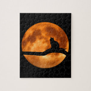 Puzzle Silhouette d'un chat noir dans un arbre