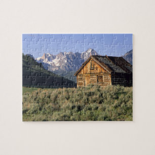Puzzle Un cabine en bois rond et les monts Sawtooth en
