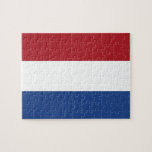 Puzzle with Flag of Netherlands<br><div class="desc">Immerse yourself in the vibrant colours of the Netherlands with our engaging puzzle featuring the flag of the Netherlands! Crafted with precision, this puzzle proudly displays the iconic tricolor flag of the Netherlands. The flag consists of three horizontal bands of equal size - red on top, white in the middle,...</div>