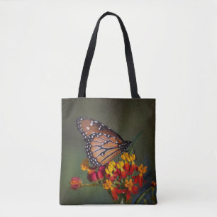 Queen butterfly on tropical milkweed tote bag