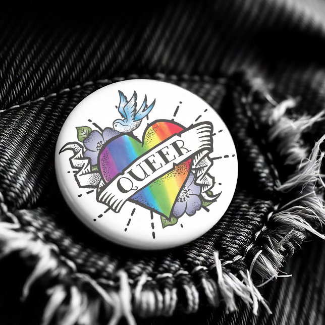 Queer Heart Tattoo 2 Inch Round Button ( Featuring a realistic image of a rainbow colored heart with Queer proudly written on the front. )
