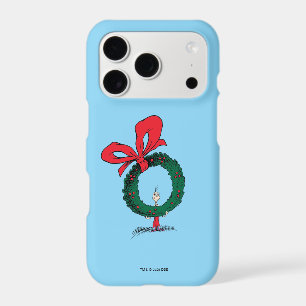 Qui regarde à travers la couronne de Noël