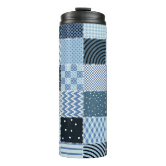 Quilt design, geometric patchwork, blue tones. thermal tumbler