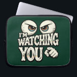 Quirky "I'M WATCHING YOU" Retro Eyes Laptop Sleeve<br><div class="desc">Protect your laptop with a touch of wit! This "I'm Watching You" laptop sleeve features a bold, suspicious eye illustration that’s sure to get a laugh at the office or coffee shop. The deep forest green background gives it a sophisticated yet fun vintage look. High-quality protection for your tech with...</div>