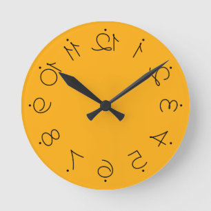 Quirky Yellow With Flipped Twisted Numbers Round Clock