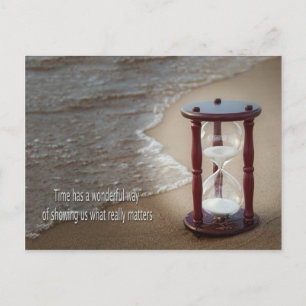 Quote with sand timer on beach holiday postcard