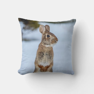 Rabbit in the snow throw pillow
