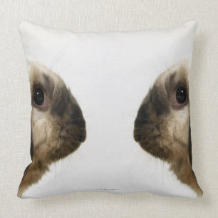 Rabbit looking at rabbit throw pillow
