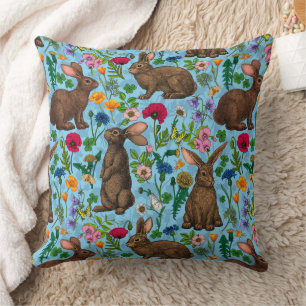 Rabbits and wildflowers throw pillow