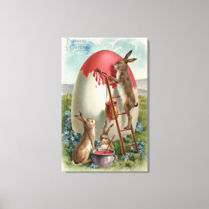 Rabbits Painting an Egg Canvas Print