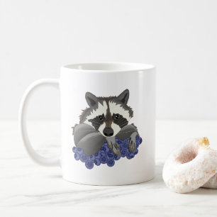 Raccoon with blueberries coffee mug