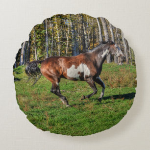 Racing Pinto Paint Stallion on a Horse Ranch Round Pillow