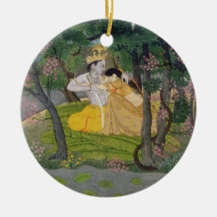 Radha and Krishna embrace in a grove of flowering Ceramic Ornament
